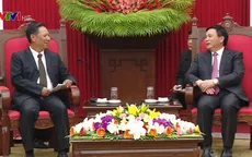 Bí thư Trung ương Đảng Nguyễn Xuân Thắng tiếp Phó Chủ tịch Hội đồng Khoa học Xã hội Quốc gia Lào