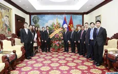Thứ trưởng Ngoại giao Nguyễn Minh Vũ chúc mừng Quốc khánh CHDCND Lào