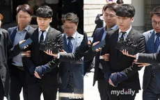 Seungri bị còng tay khi rời tòa