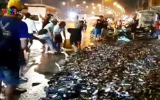 Lật xe tải trên QL1A, gần 3 tấn cá đổ ra đường