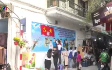 Người dân tham gia làm đẹp đường phố chào mừng Đại hội Đảng lần thứ XIII