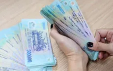 Lương tối thiểu áp dụng ra sao khi bỏ quận, huyện?
