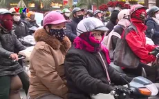 Hà Nội rét 12 độ C, người dân bịt kín khi ra đường