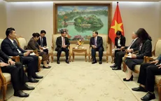 Phó Thủ tướng Thường trực Chính phủ Phạm Gia Túc tiếp Bí thư Thành ủy, Chủ tịch HĐND Thủ đô Vientiane