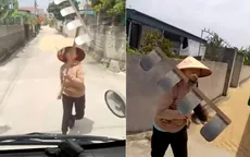 Dùng cào tấn công tài xế khi bị nhắc nhở phơi lúa trên đường