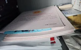 Làm giả tài liệu, con dấu rồi thuê xe ôm đi giao cho khách hàng