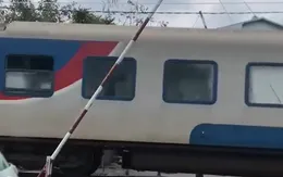 Gác chắn không có người đóng khi tàu hỏa chạy qua ở Đồng Nai