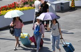Trung Quốc ban bố cảnh báo vàng về nắng nóng trong bối cảnh lũ lụt lan rộng