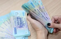 Lương tối thiểu áp dụng ra sao khi bỏ quận, huyện?