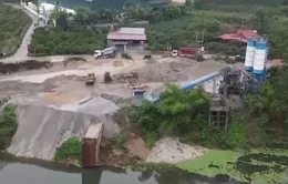 Nhiều trạm trộn bê tông hoạt động trái phép xả thải ra sông