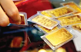 Giá vàng tăng dè dặt, tỷ giá USD hạ nhiệt