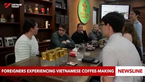 Foreigners experiencing Vietnamese coffee-making