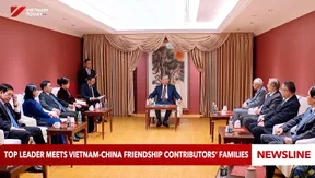 Top leader meets Việt Nam-China friendship contributors’ families