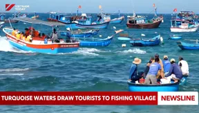 Turquoise waters draw tourists to fishing village