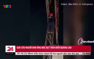Giải cứu người đàn ông mắc kẹt trên biển quảng cáo