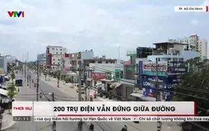 200 trụ điện vẫn đứng giữa đường 