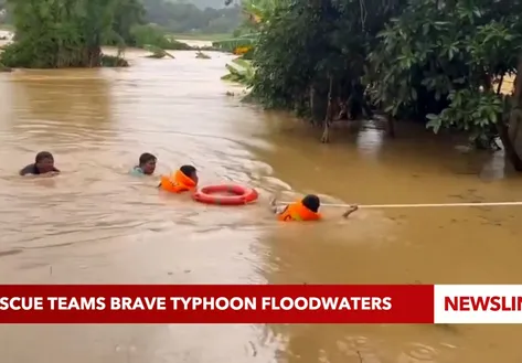 Rescue teams brave typhoon floodwaters