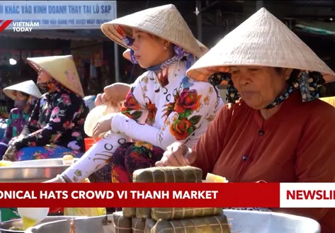 Conical hats crowd Vi Thanh market