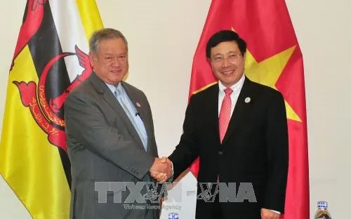 APEC 2017: Phó Thủ tướng Phạm Bình Minh gặp Bộ trưởng thứ hai Ngoại giao và Thương mại Brunei