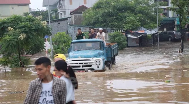 Torrential night rain causes floods across Ha Noi