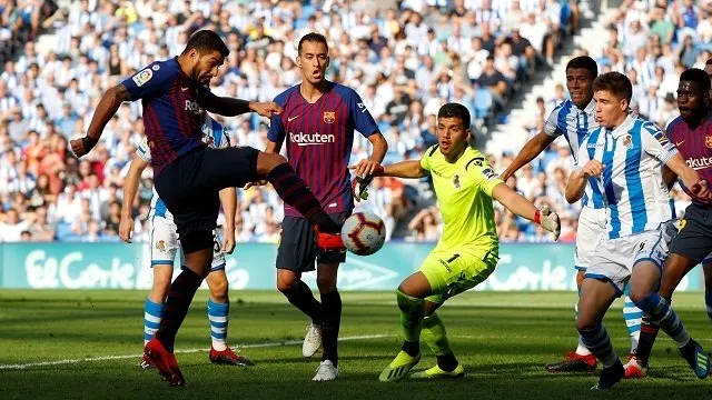 Barca ride luck to sink Sociedad, Real held in Bilbao