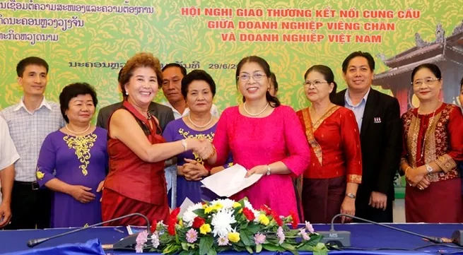 Vientiane conference links VN, Lao firms