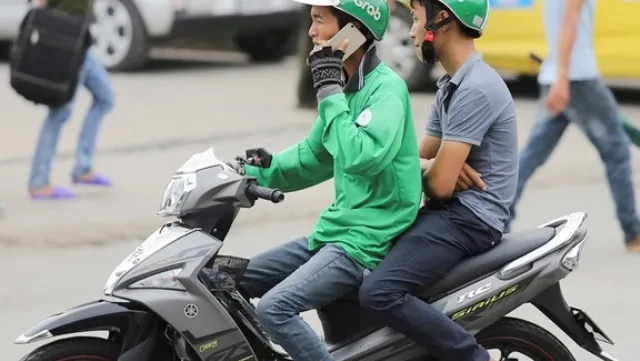 Grab riders to get penalised for using phones while riding