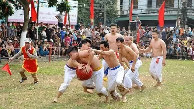 Village men wrestle for ball in unique festival in Hanoi