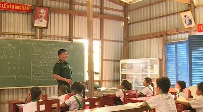 The teacher with a class on the island