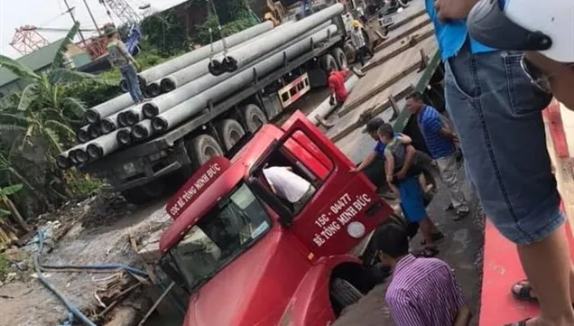 Road collapses after container truck breaks water pipeline