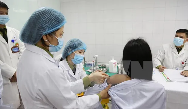 First three volunteers receive first shots of 50mcg dose of COVID-19 vaccine