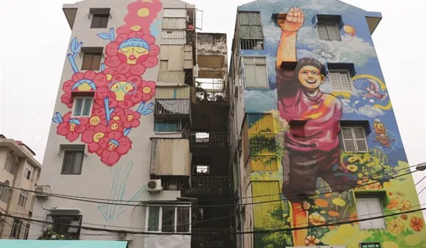 Colourful murals cover old buildings in HCM City