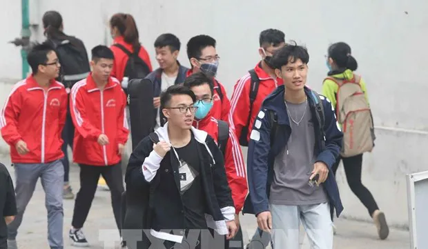 Universities plan to receive students for in-person learning after Tet