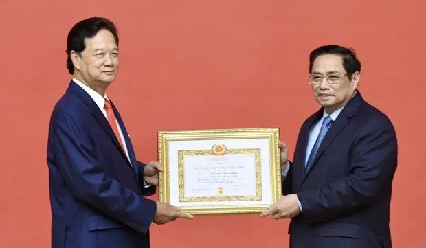 Former Prime Minister presented with 55-year Party membership badge