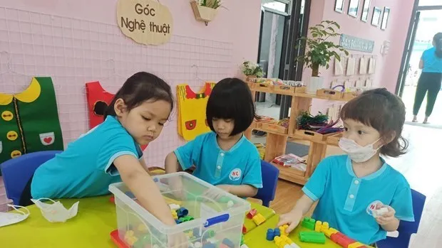 Kindergarten students in Hanoi return to school