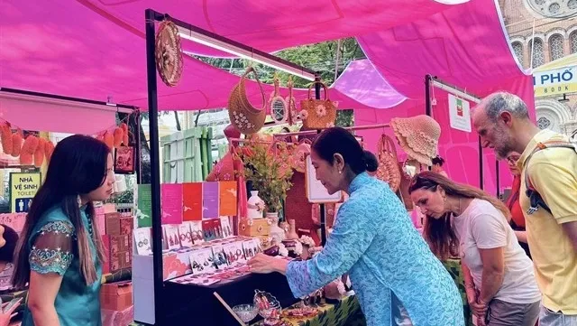 Art programme honouring Ao dai opens at HCM City Book Street